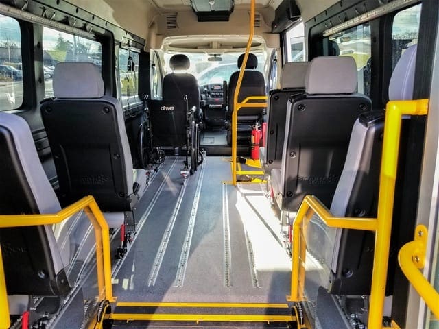 AMF Smartfloor system shown in Ram Promaster 3500 wheelchair mobility van with removeable 17 inch seats on wheels, wheelchair restraint securement system for mobility transportation