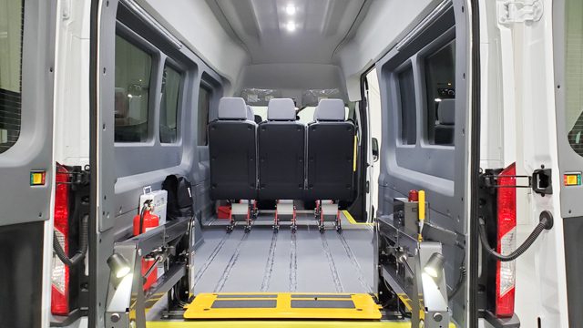 Wheelchair securement area inside Ford Transit mobility van. 8 passenger seating plus 2 wheelchairs