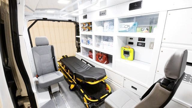 NEMT Van interior with aluminum cabinetry and stretcher