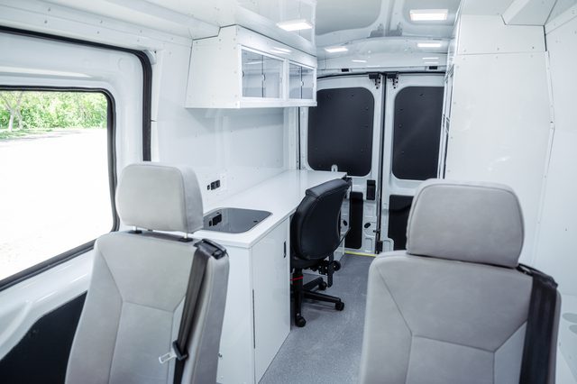 seats and mobile office inside community outreach van