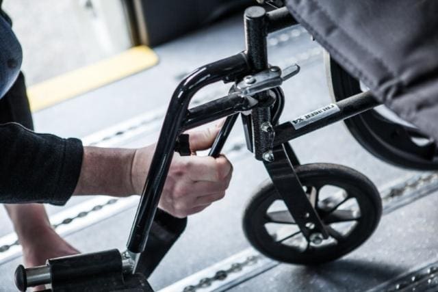 Hook securement on a wheelchair in an accessible van