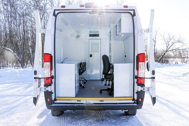 Rear side of Mobile Mitigation van (MM Model) with back doors open for additional access to air and light.