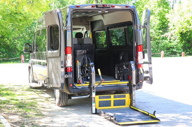 Rear view of rear entry Ram Promaster wheelchair van with powered lift.