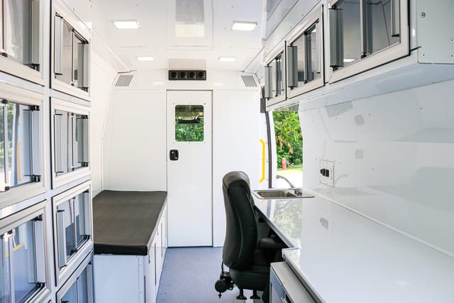 Mobile medical clinic in Ford Transit 148 Wheelbase, Single Rear Wheel, High Roof Model. Use for door to door health assessments and vaccinations. Includes mobile office and patient exam bed.