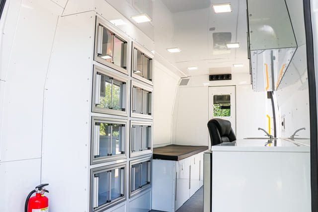 Aluminum storage cabinets inside Mobile Medical Clinic Van