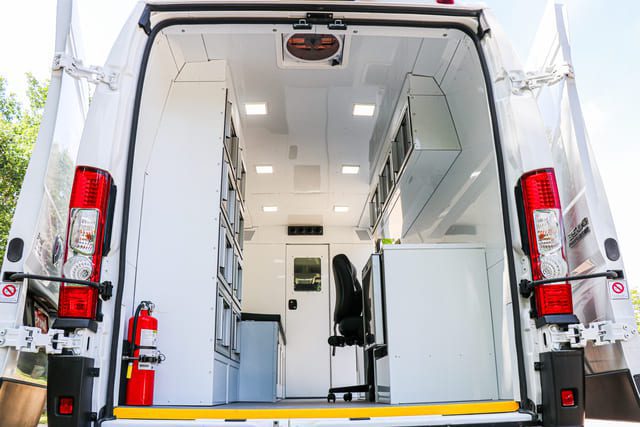 Mobile Medical Clinic Van with aluminum storage cabinets. Fire extinguisher included.