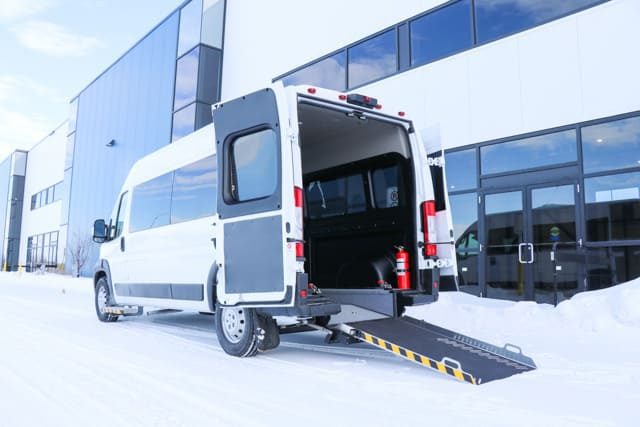 Rear view of VL Series wheelchair van with lowered ramp.