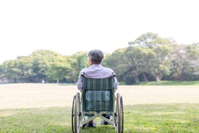 Photo of elderly man in wheelchair