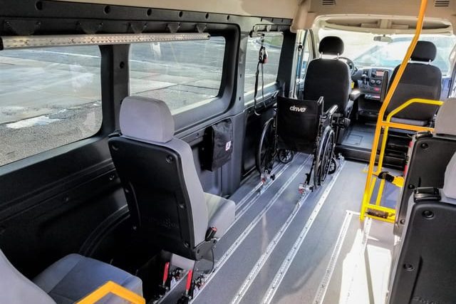 AMF Smartfloor system shown in Ram Promaster 3500 wheelchair mobility van with removeable 17 inch seats on wheels, wheelchair restraint securement system for mobility transportation