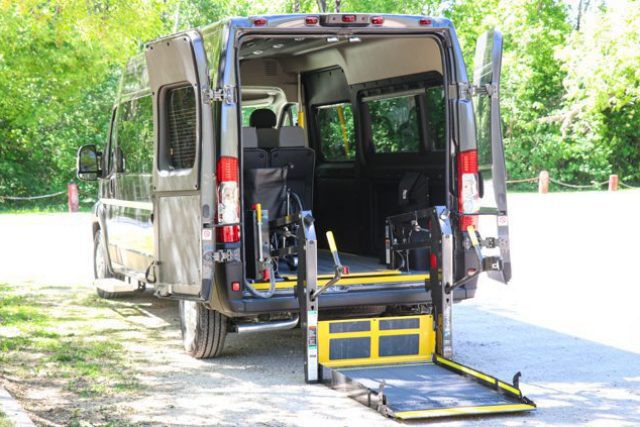 Rear view of rear entry Ram Promaster wheelchair van with powered lift.